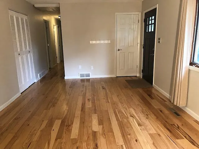 Front door, main living room, coat closet