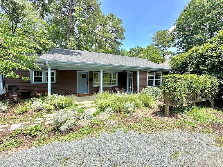 Front of house with porch and parking