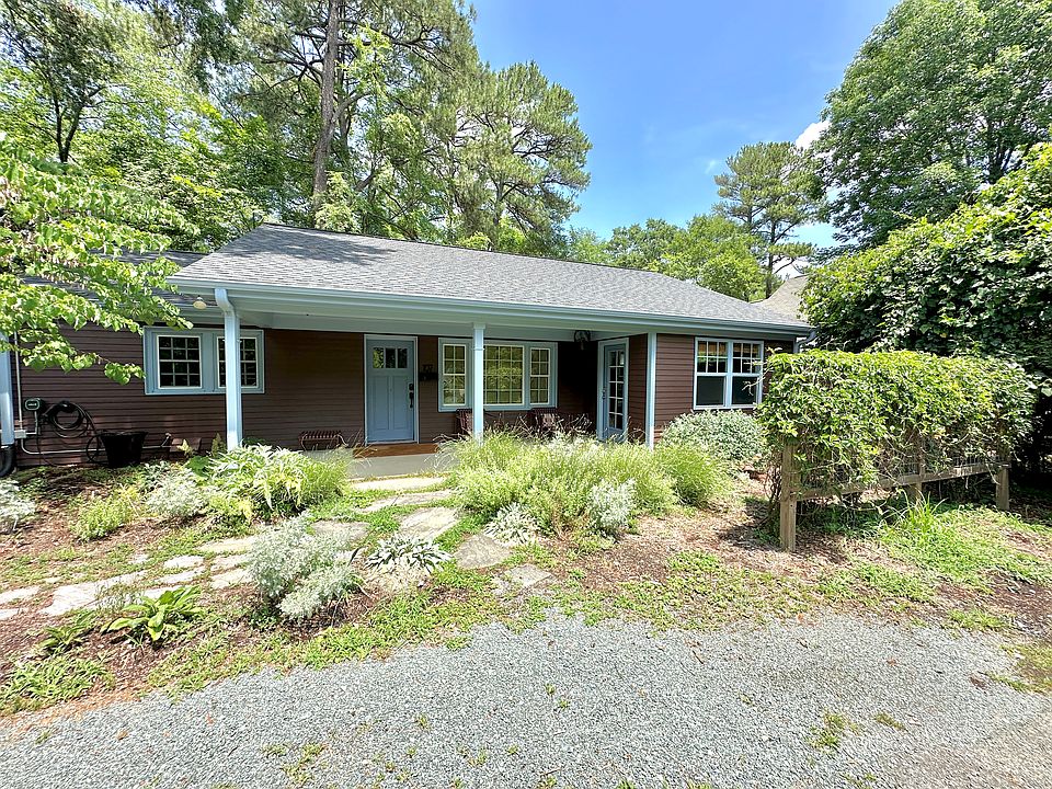 Front of house with porch and parking