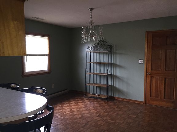 Upstairs kitchen with side door leading to deck