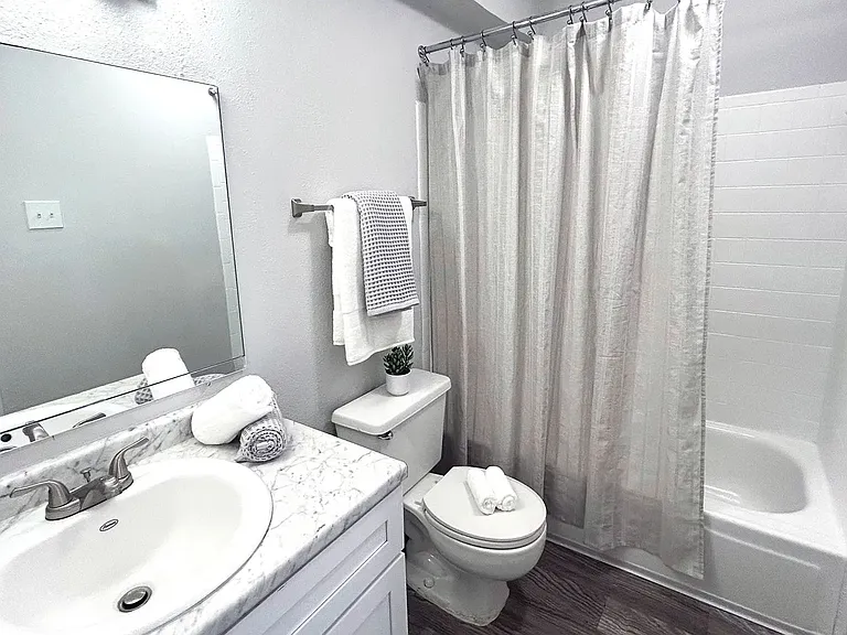 Vanity lighting, full-size garden tubs, and extra storage space add a touch of comfort to our bathrooms.