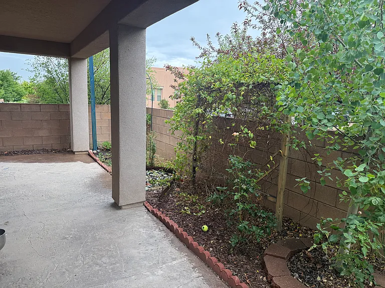 Walled backyard and covered portal