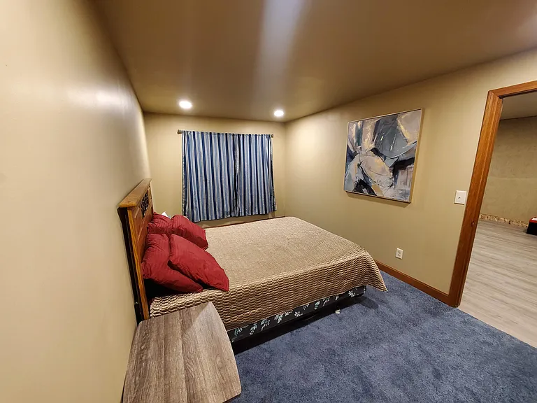 Basement bedroom with queen size bed