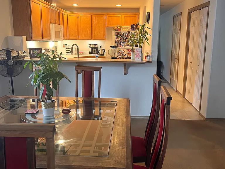 Enjoy a bright, open kitchen designed for modern living. The extended countertop easily accommodates barstools, making it a great spot for morning coffee, quick bites, or chatting with guests while you cook.