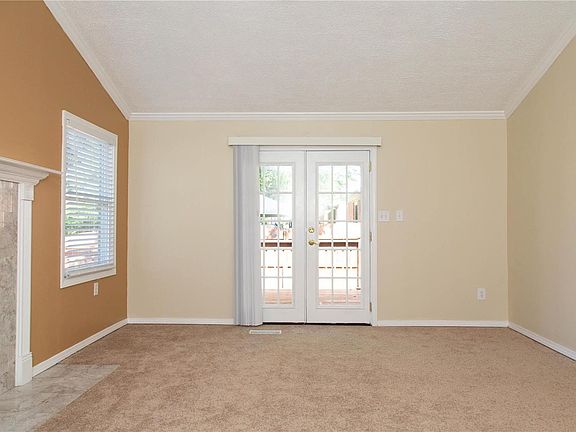 All the interior has been newly painted. Through these atrium doors is a spacious deck.