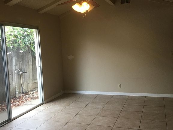 Dining area with large slider to side and back yard.