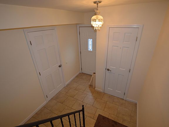 foyer on the first floor with coat closet and access to garage