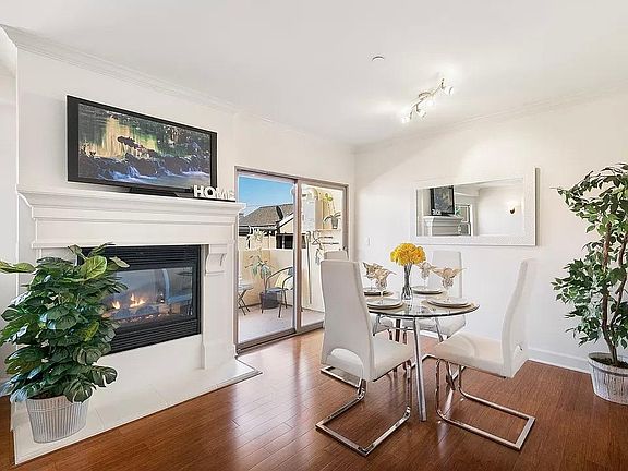 Dining Room with electric fireplace, connects to living room.