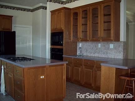 Beautiful Cabinets : With glass and huge gas island cooktop. Built-in microwave and oven.