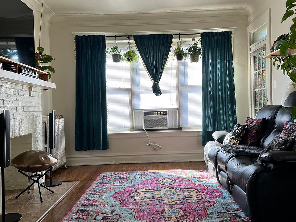 Sunny living room with decorative fireplace