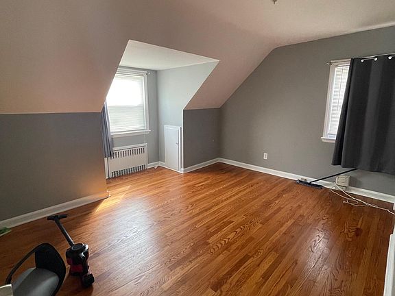 Bedroom 1 with closet and storage space in walls.