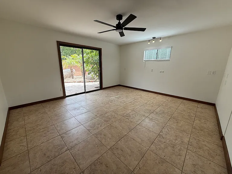 1 of 5 bedrooms. This one has direct access to the backyard and pool!