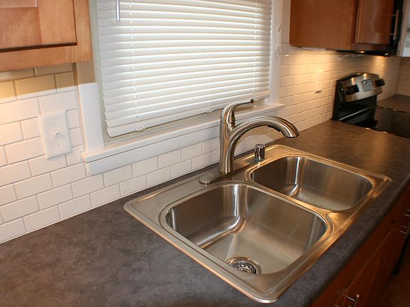 new kitchen with tile backspalsh