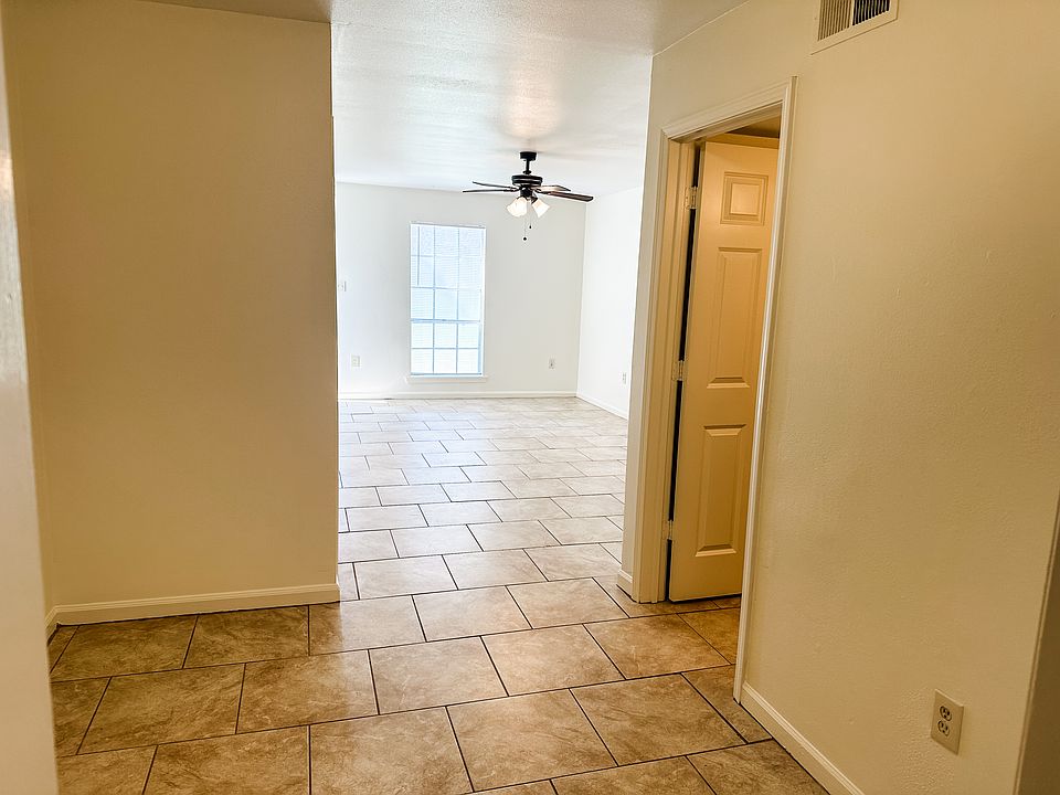 Dining space looking into living area. 1/2 bath to right.