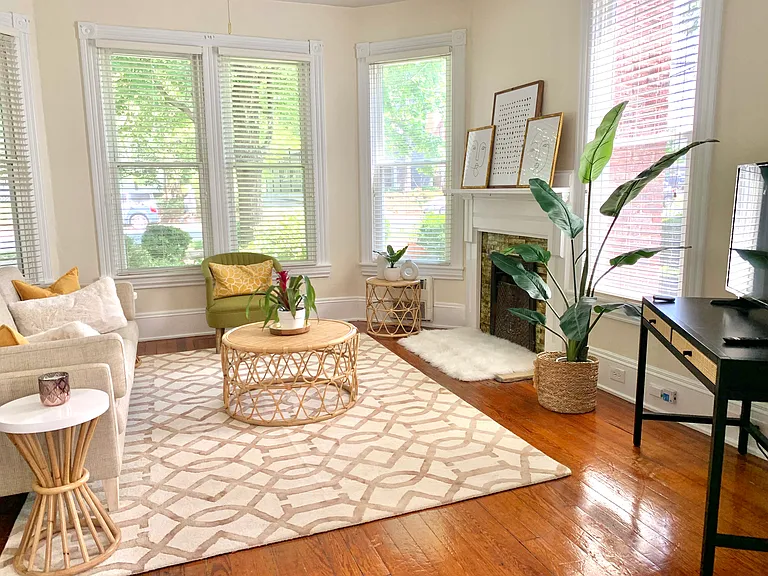 Tall windows with streaming sunlight. Historic accents include pine flooring, pocket doors, footed tub. Enchantment