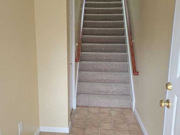 Entry Way (stairs to living area) Large closet on right.