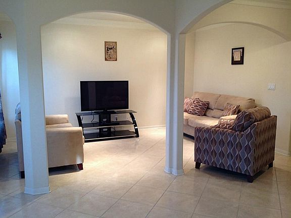 Another view of the living area showing the wonderful arches that can aww your guests.
