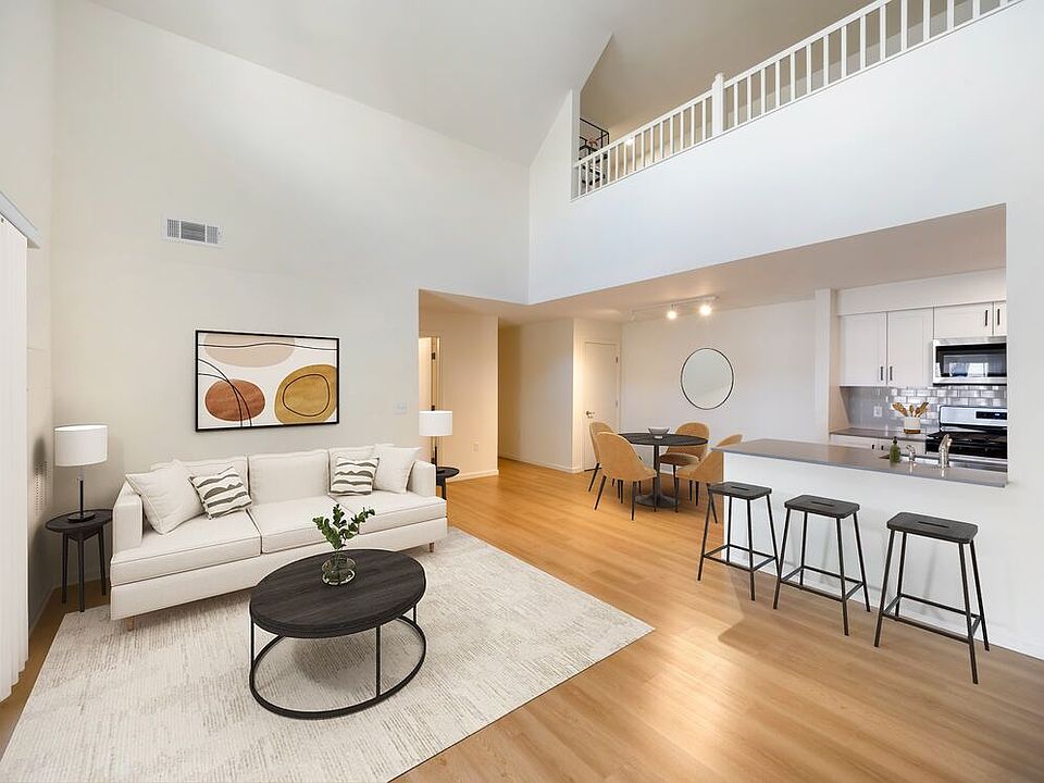 New Apartments kitchen, dining, and living room with hard surface flooring