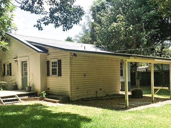 Covered area in backyard perfect for grilling and entertaining!