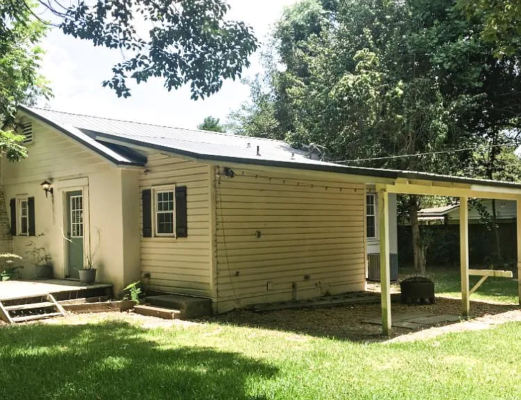 Covered area in backyard perfect for grilling and entertaining!