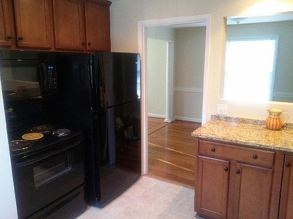 Kitchen with new maple cabinets, granite countertops & updat