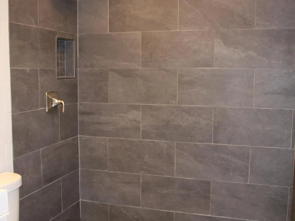 Shower floor with a Linear Drain along the back wall. Seamless walk into this shower.