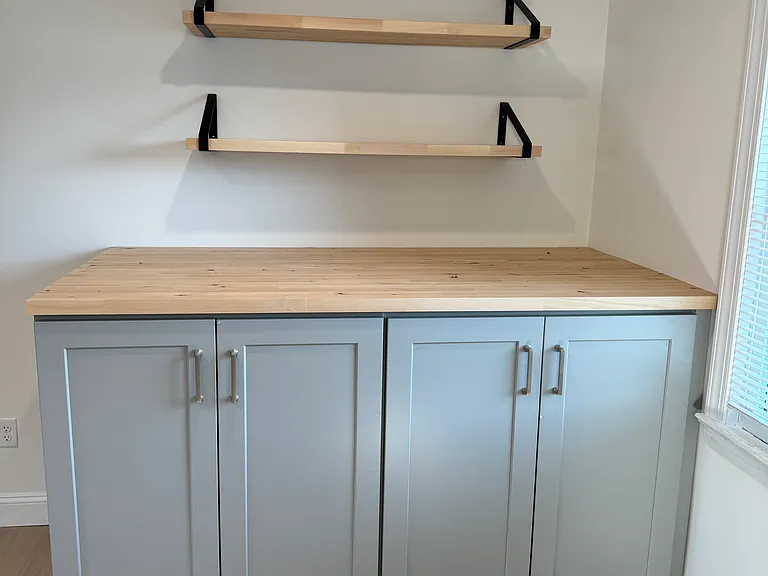 Washer and dryer hook-up hidden in the custom cabinet.