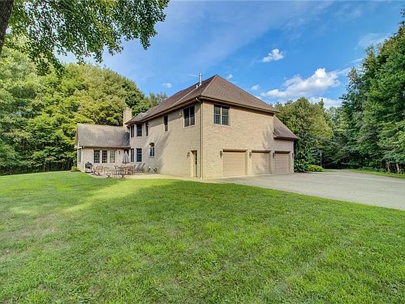 The concrete patio offers a fabulous place for a cookout while enjoying the park-like setting and fabulous views.