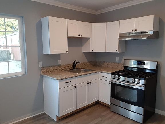 Kitchenette area with stove and refrigerator area. (Refrigerator will be installed before move in)