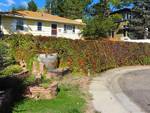 House located on hill top in central Boulder.,