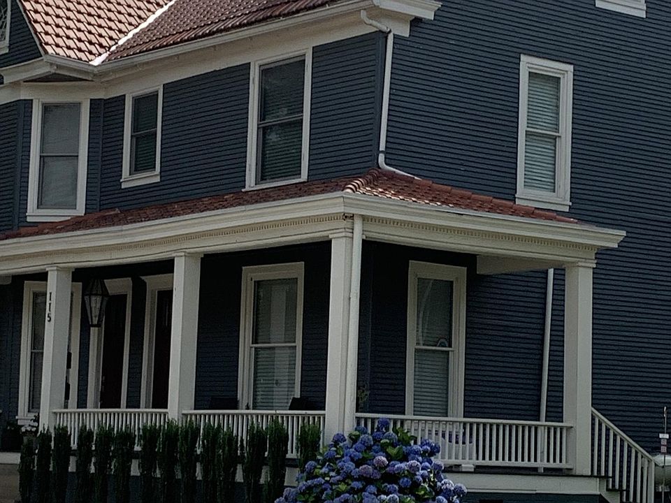 Beautiful well-maintained house with lovely landscaping.