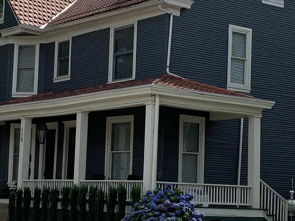 Beautiful well-maintained house with lovely landscaping.