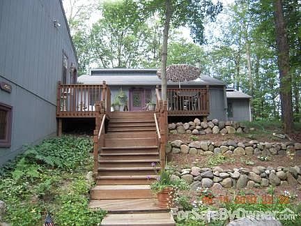 View from driveway
						:
						Garage on left, apartment above the garage on same level of the house.