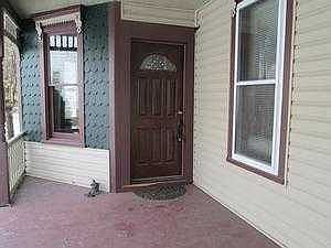 Porch with intricate wood trim