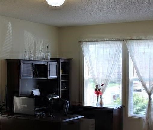 Living room seller uses as an office.