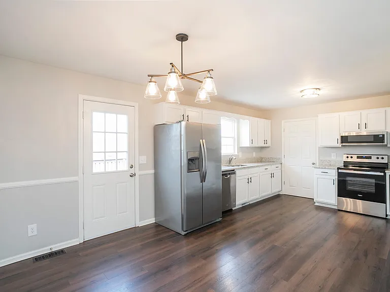 Kitchen has a large pantry as well as a spacious laundry room