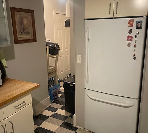 Kitchen area with back pantry.