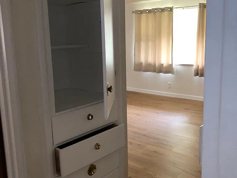 Built in dresser for linens or storage in hall to bathroom and bedrooms
