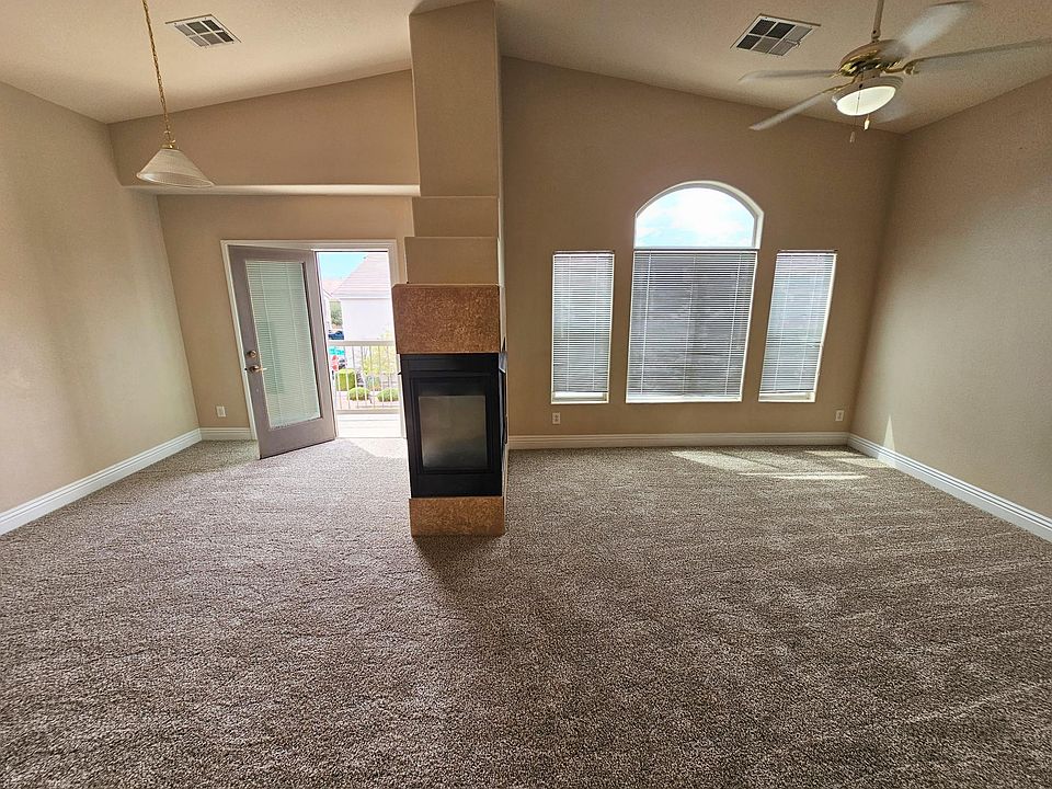 Living room/dining room with door to balcony.
