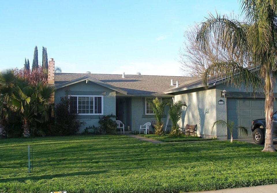 Front yard with lots of Qween Palms