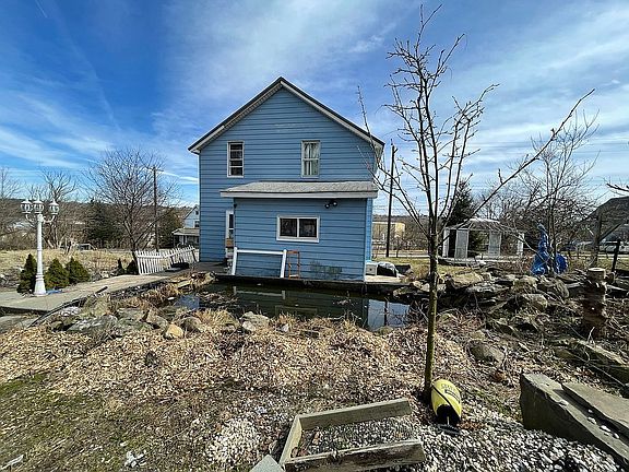 Back of house and pond.