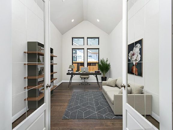 Cathedral ceiling and glass doors in office