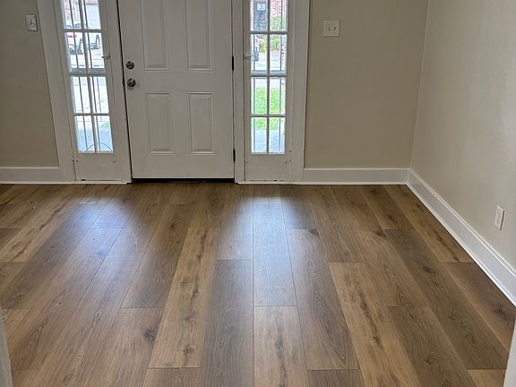 The living room is off the kitchen with new flooring and cable hookup ready for you.