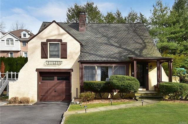 Bright Storybook Tudor on quiet street