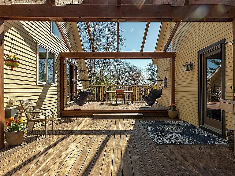Upstairs deck between house and detached garage