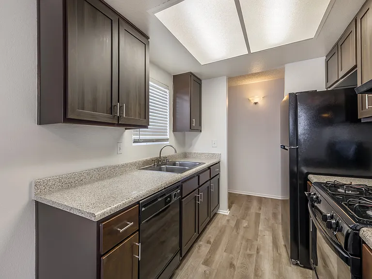 Sedona Apartments in Moreno Valley features renovated homes with modern flooring, updated cabinets, and stylish black appliances for a fresh, contemporary feel.