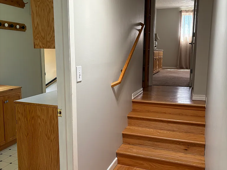Hallway - showing stairs to Primary Ensuite and Utility Room