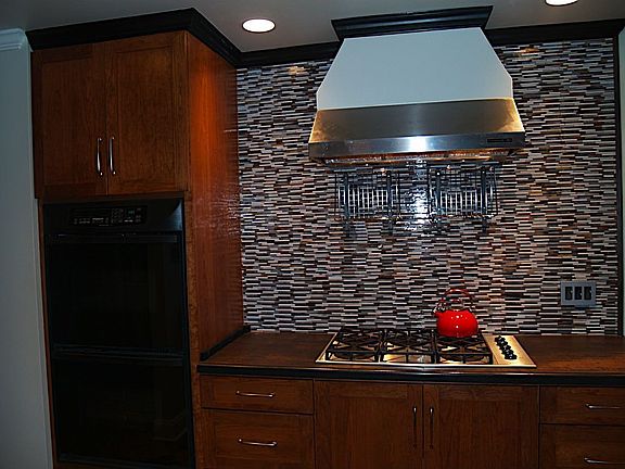 View highlighting the feature wall in the kitchen made up of sea-blue, sand, c