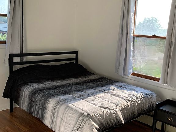 Light filled bedroom with new flooring. Has large closet.