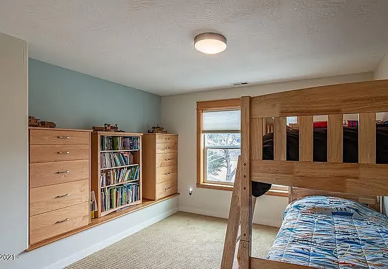 Second Bedroom with Burber Carpet and Two Built-in Maple Dressers.
